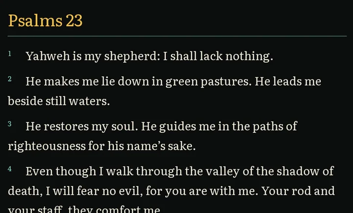 Psalms 23, verses 1 to 3 and most of verse 4, in the Chi Rho theme, the default: parchment text on a near-black background with gold headings.